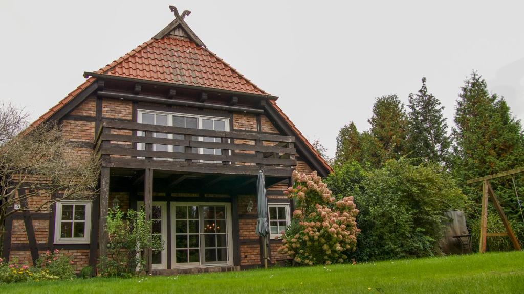 a small wooden house with a roof at Ute's Fachwerk in Wolthausen