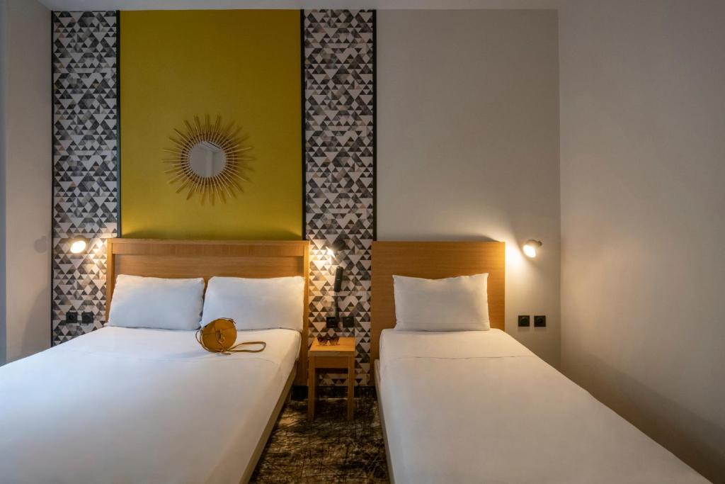 Postel nebo postele na pokoji v ubytování Hotel d'Ostende