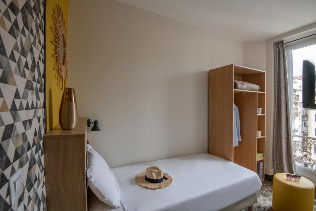 Postel nebo postele na pokoji v ubytování Hotel d'Ostende