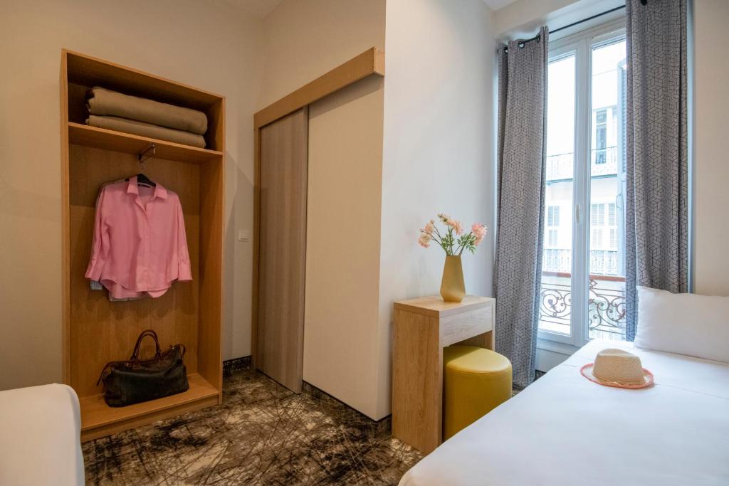 Postel nebo postele na pokoji v ubytování Hotel d'Ostende