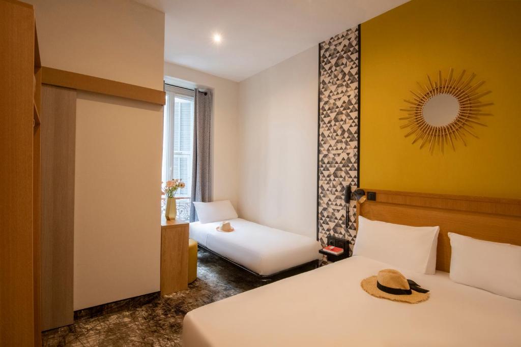 Postel nebo postele na pokoji v ubytování Hotel d'Ostende