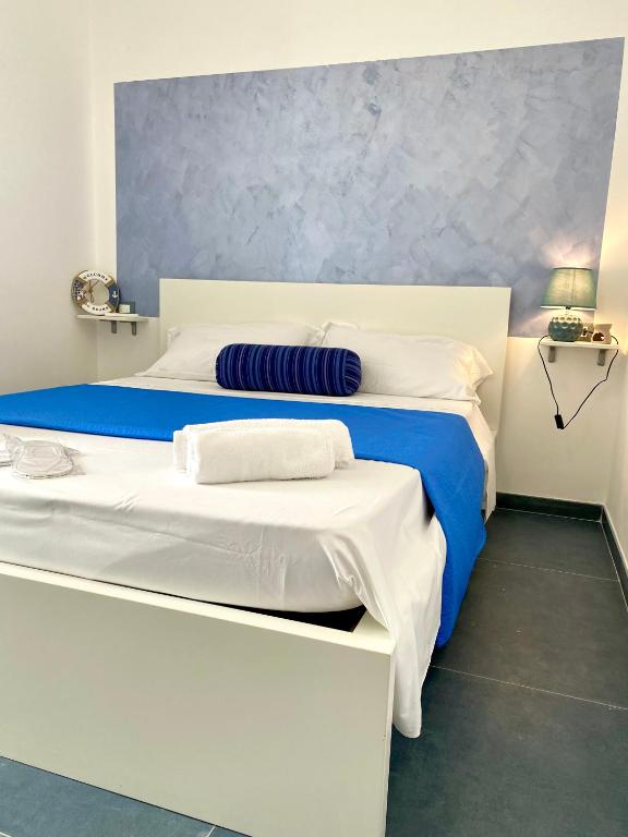 Postel nebo postele na pokoji v ubytování Sperlonga Paradise Suites 500m dal mare in estate Servizio navetta per Sperlonga centro