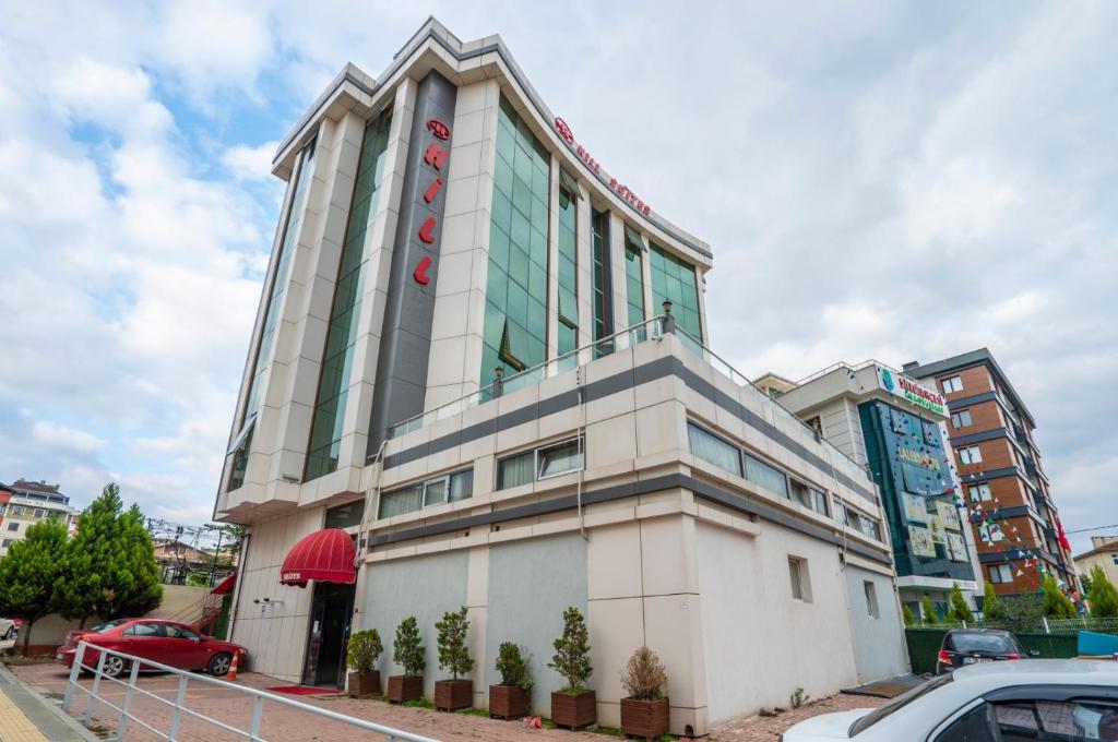 a building with a sign on top of it at 216 Hill Suites in Istanbul