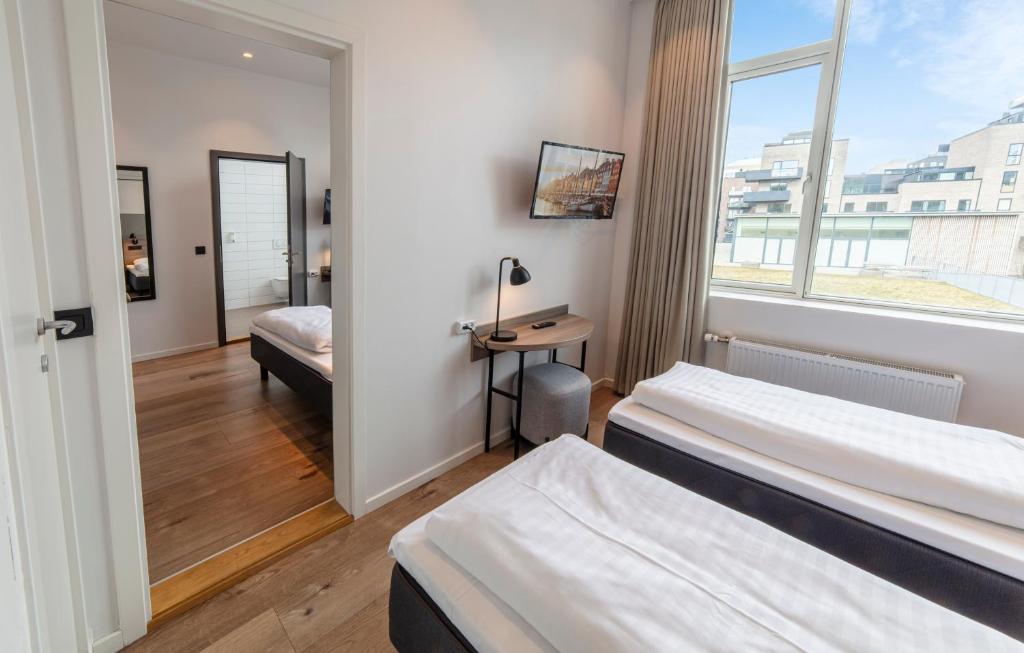Uma cama ou camas num quarto em Go Hotel City