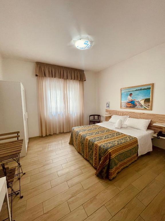 Postel nebo postele na pokoji v ubytování Hotel La Bussola