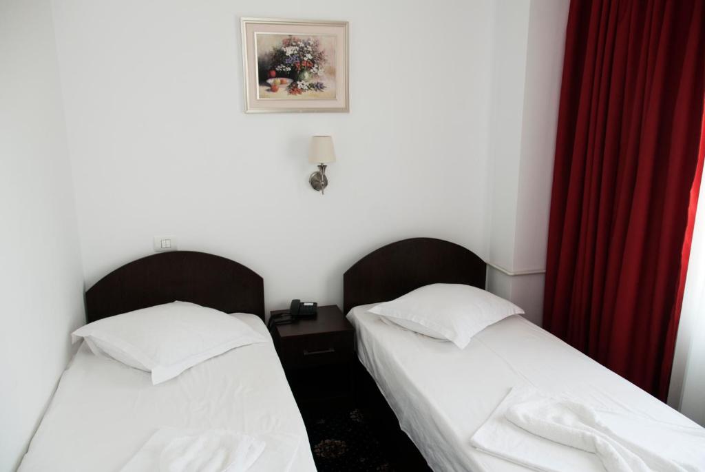Postel nebo postele na pokoji v ubytování Hotel Cristian