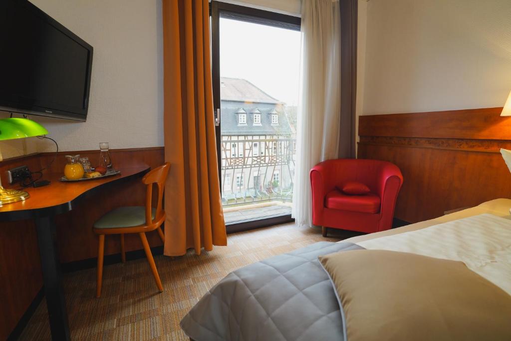 Postel nebo postele na pokoji v ubytování Gästehaus Präsenzhof