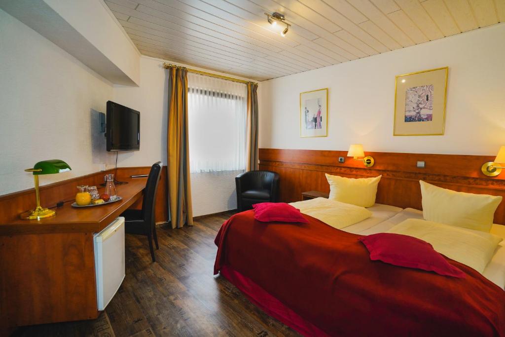 Postel nebo postele na pokoji v ubytování Gästehaus Präsenzhof