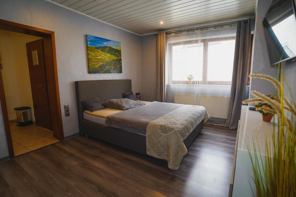 Postel nebo postele na pokoji v ubytování Gästehaus Präsenzhof