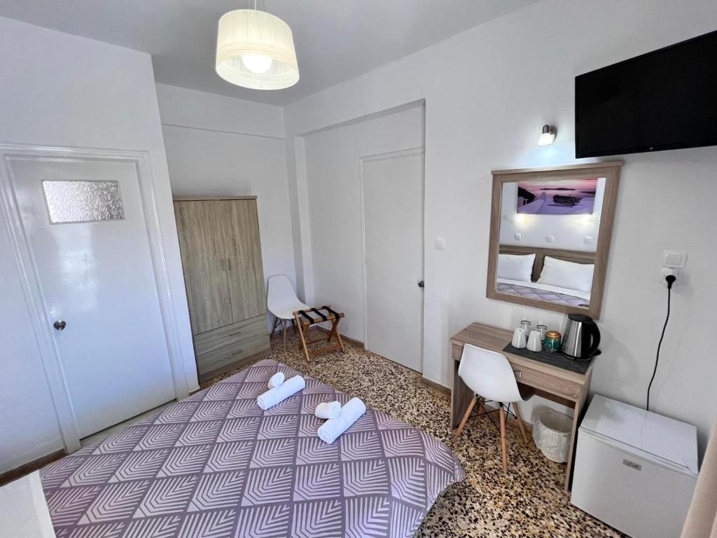 Postel nebo postele na pokoji v ubytování Firaxenia rooms