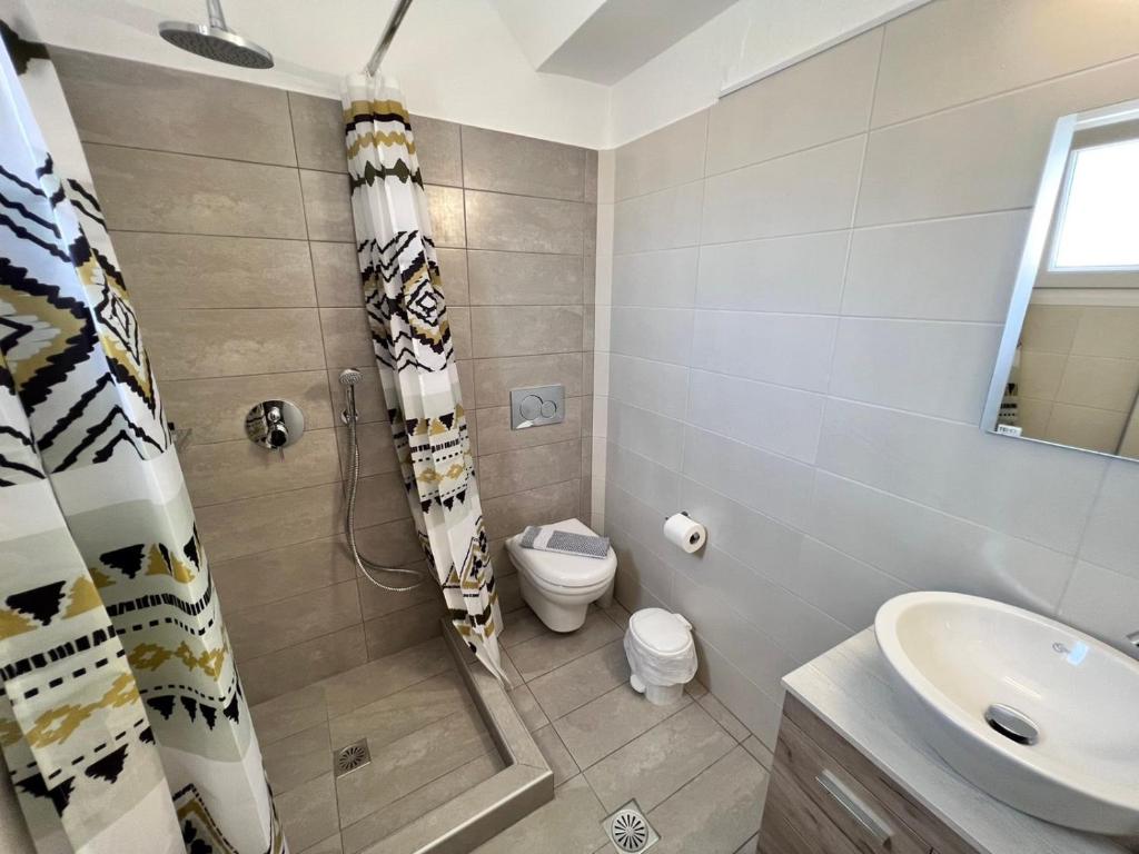 Koupelna v ubytování Firaxenia rooms