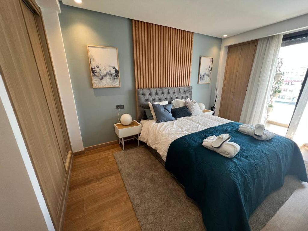 Una cama o camas en una habitación de Prime suites - Casablanca corniche