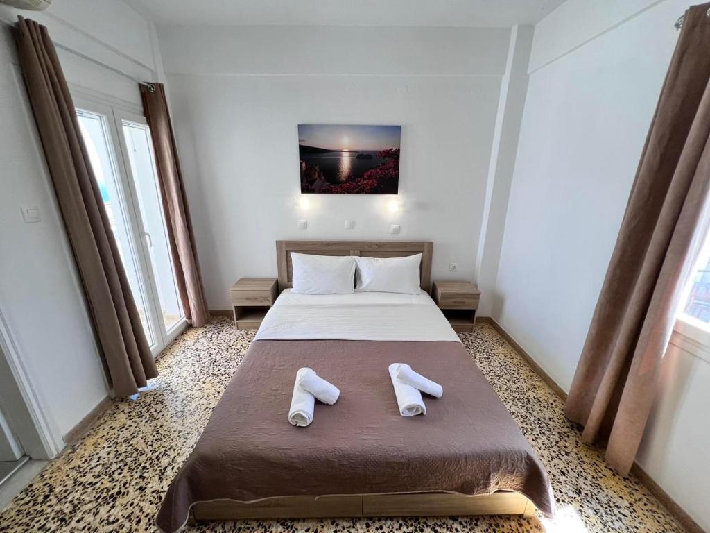 Postel nebo postele na pokoji v ubytování Firaxenia rooms