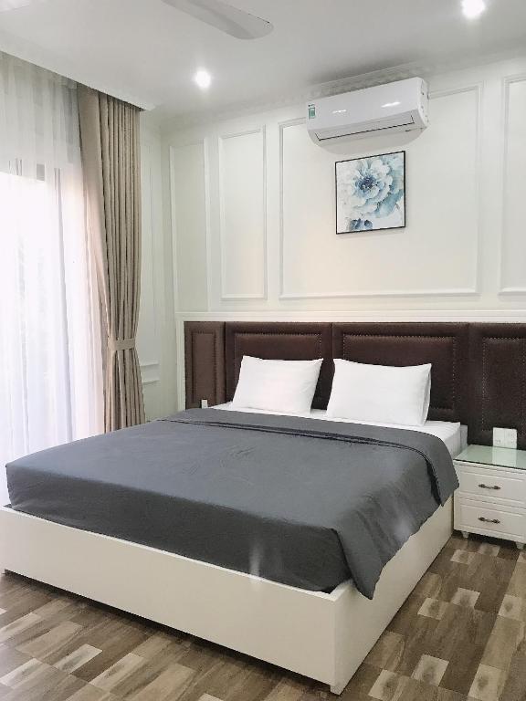 Postel nebo postele na pokoji v ubytování Lynh's Villa