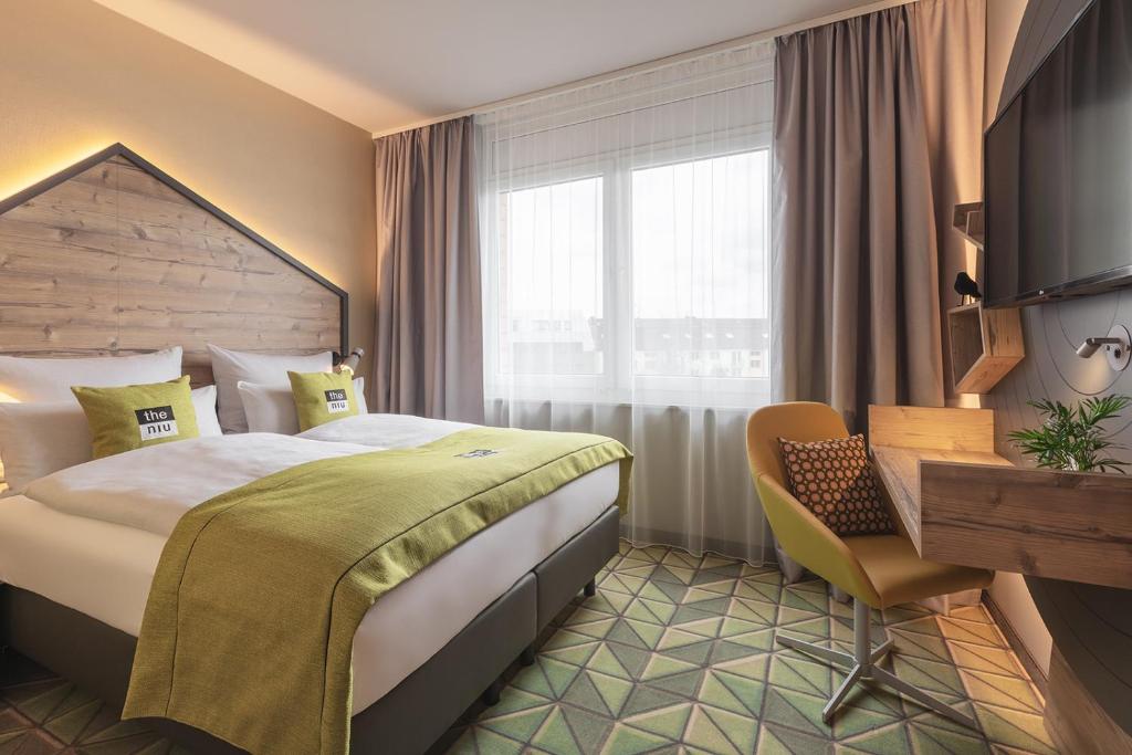 Postel nebo postele na pokoji v ubytování Holiday Inn - the niu, Mill Cologne Mülheim by IHG