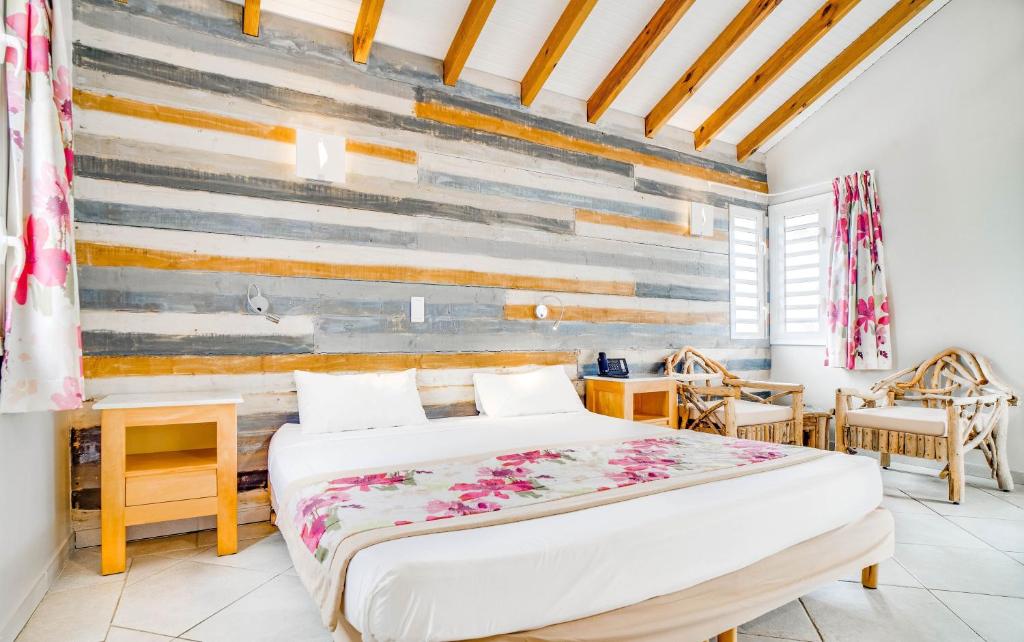 Hôtel Bambou & Spa客房内的一张或多张床位