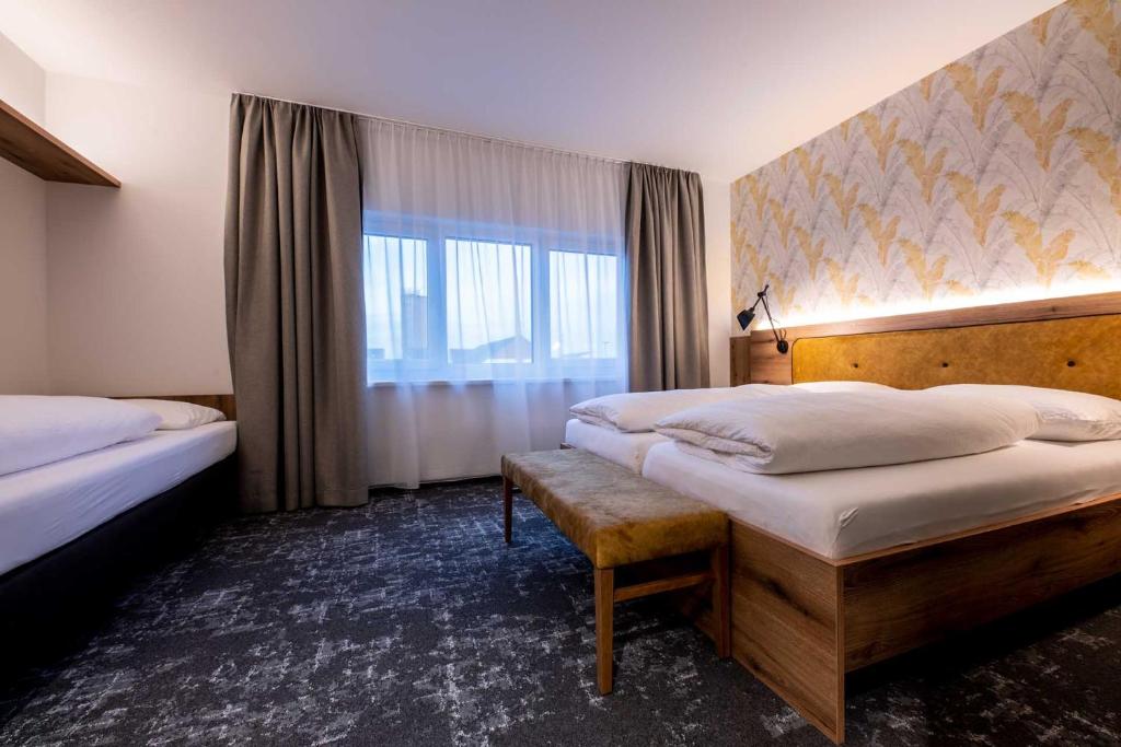Sleep in Premium Hotel Eggenburg&#x623F;&#x9593;&#x7684;&#x5E8A;