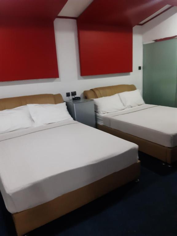 Postel nebo postele na pokoji v ubytování 999 Hotel