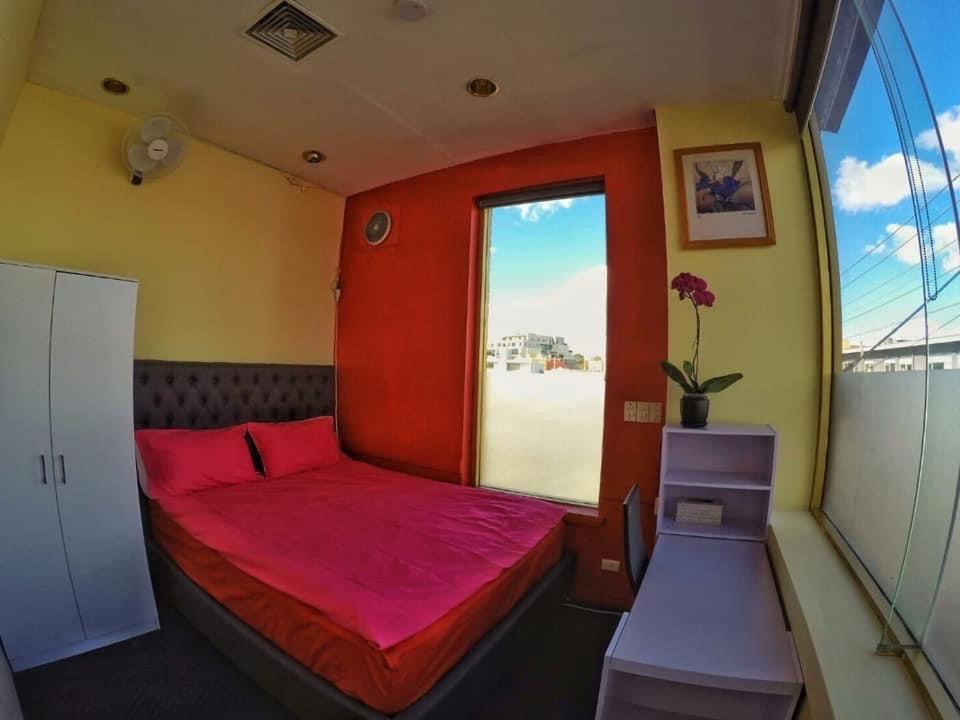 Postel nebo postele na pokoji v ubytování lilihostel