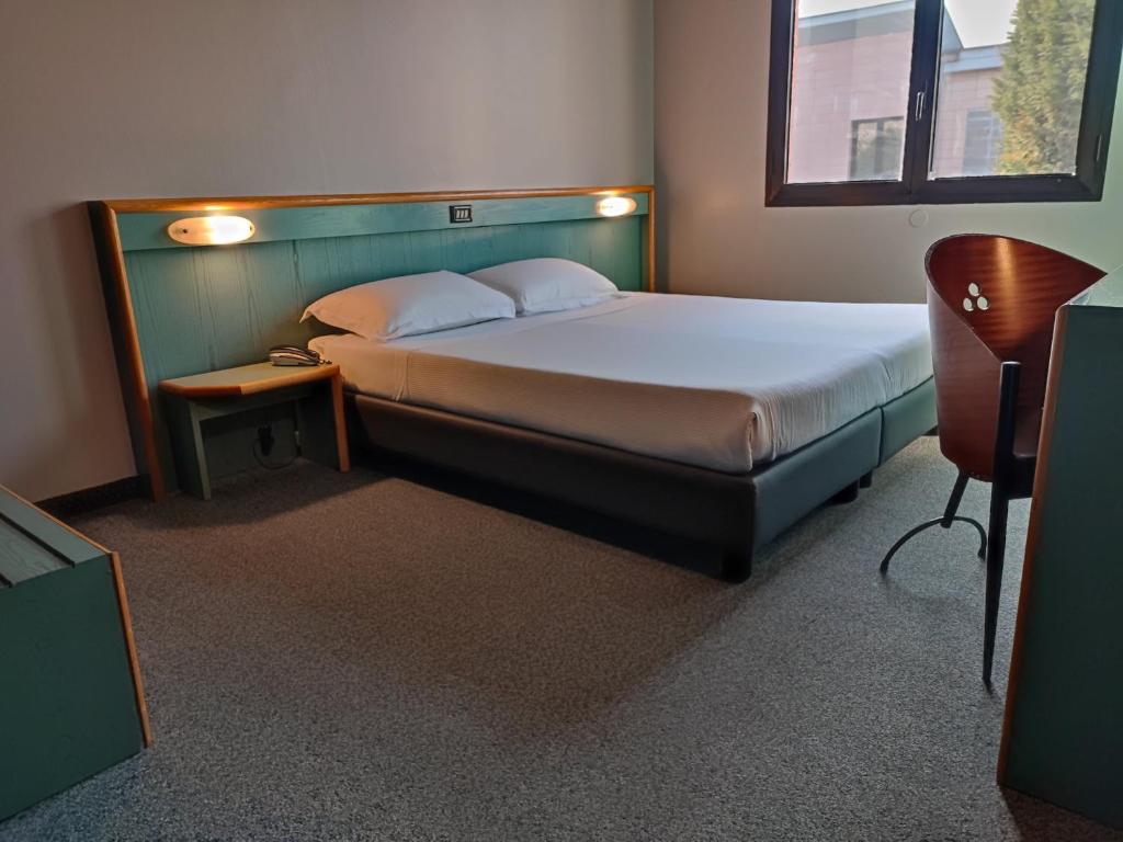 Postel nebo postele na pokoji v ubytování Stay Hotel