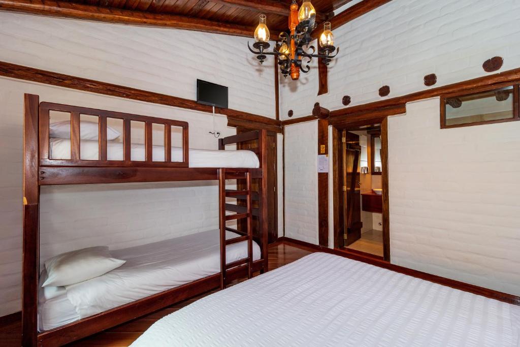 Postel nebo postele na pokoji v ubytování Hotel ILÉ
