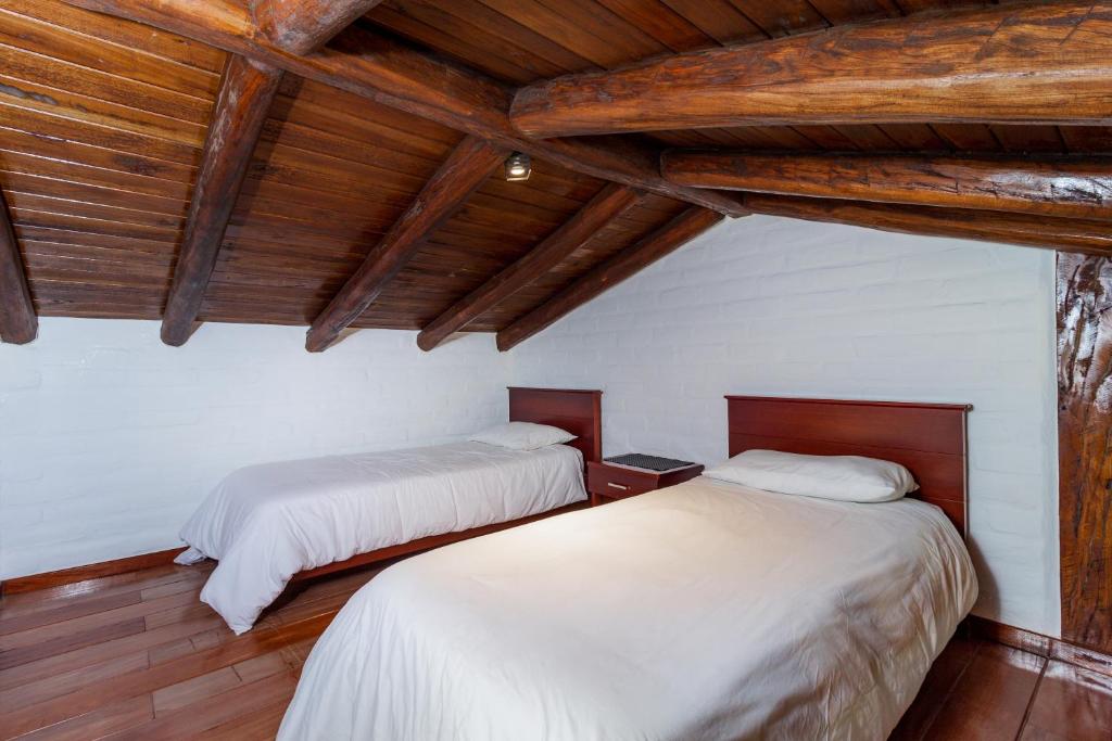 Postel nebo postele na pokoji v ubytování Hotel ILÉ