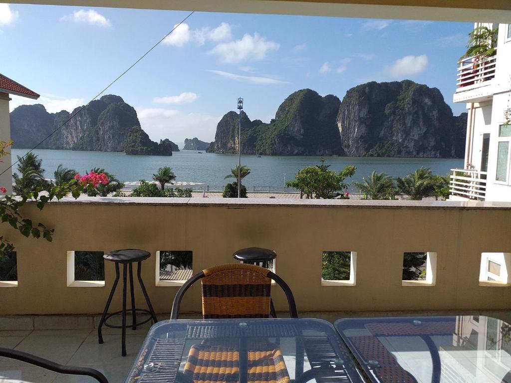a balcony with a view of a body of water at Hạ Long Lily Homestay in Ha Long