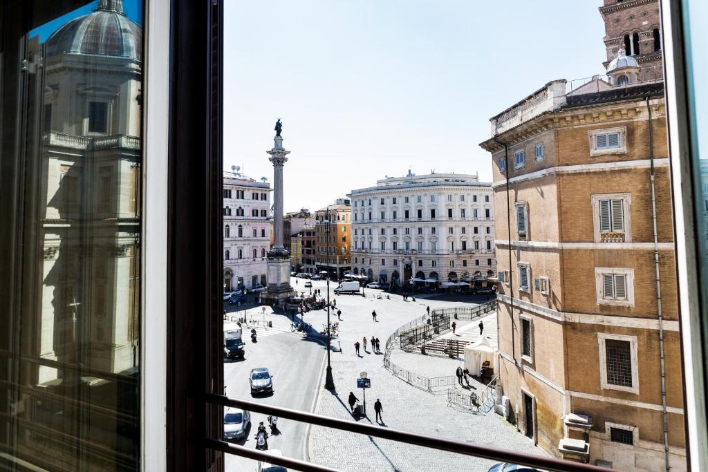 a view of a city street from a window at MyTinyHome Esquilino in Rome