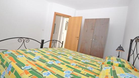 Postel nebo postele na pokoji v ubytování Residence Punta Pizzo