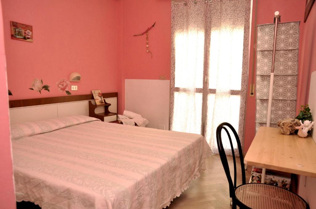 En eller flere senge i et værelse på Hotel Sabbia d'Oro