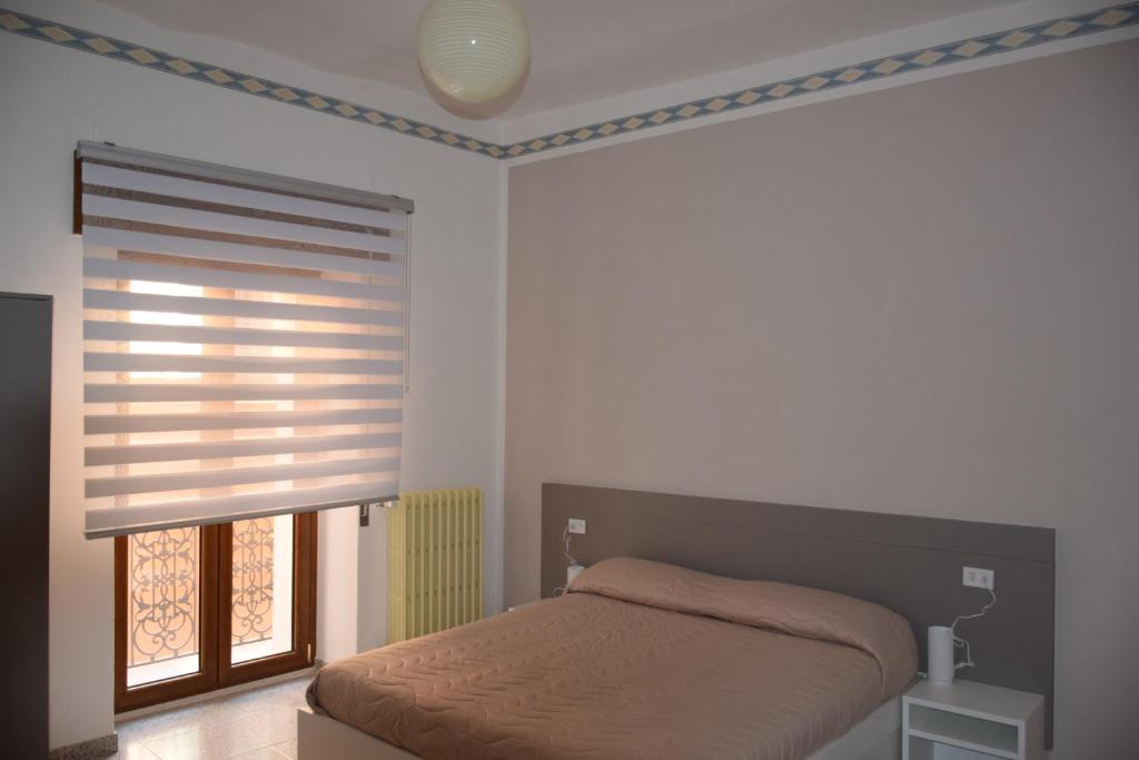 Postel nebo postele na pokoji v ubytování Locanda Pezzolla
