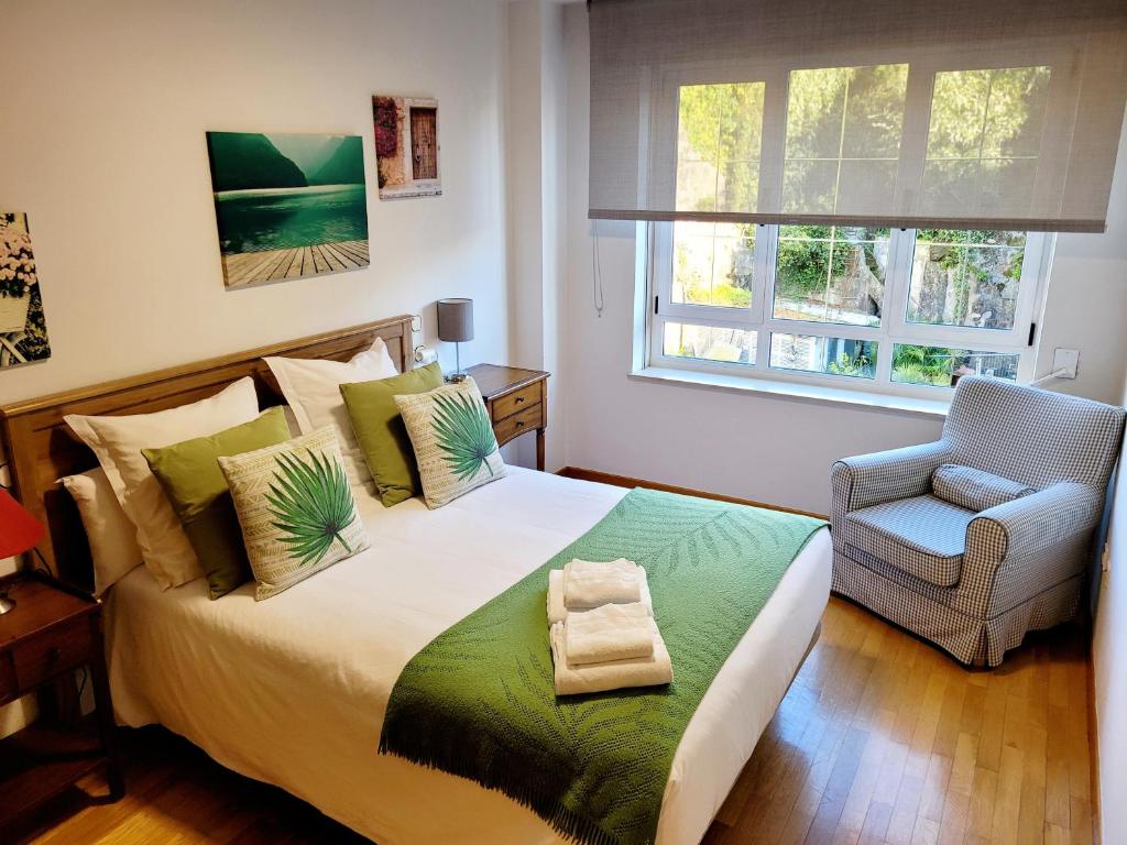A bed or beds in a room at Piso con garaje en la entrada del camino portugués