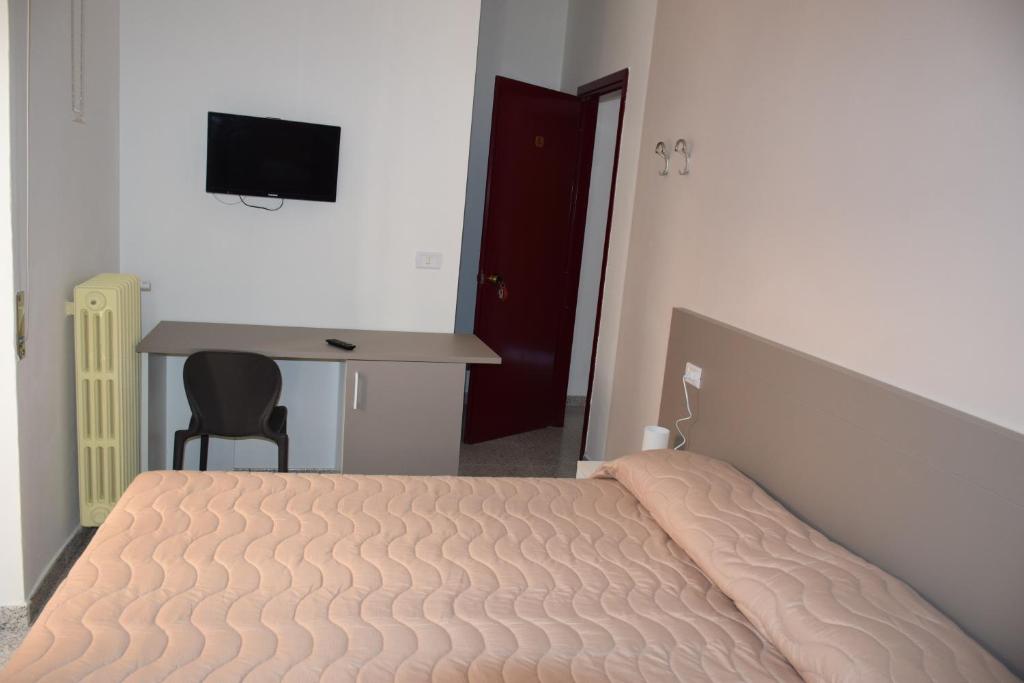 Postel nebo postele na pokoji v ubytování Locanda Pezzolla