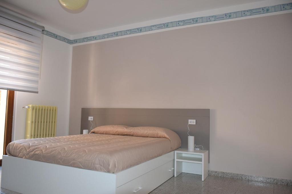 Postel nebo postele na pokoji v ubytování Locanda Pezzolla