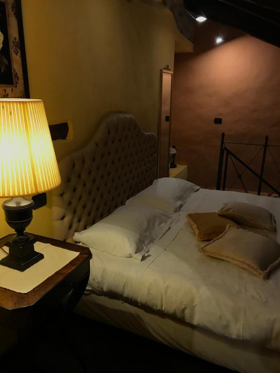 Postel nebo postele na pokoji v ubytování Dimora I Manichei