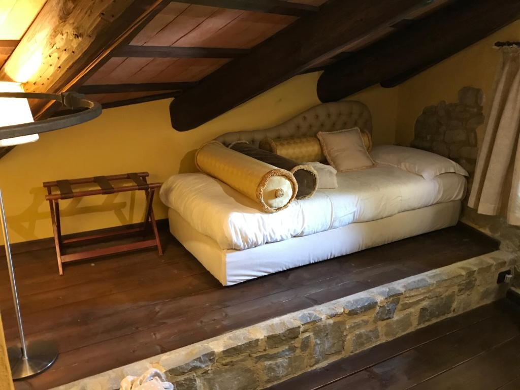Postel nebo postele na pokoji v ubytování Dimora I Manichei