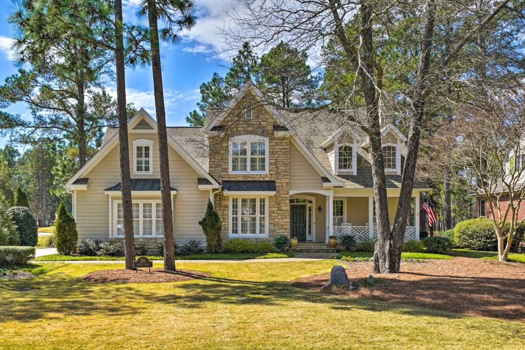 a house with a flag in a yard at Golfers Dream Near Clubhouse of PCC No 6! in Pinehurst