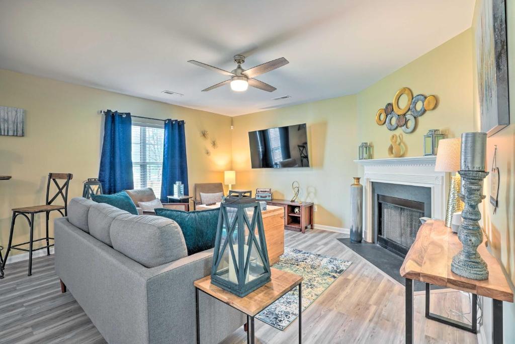 a living room with a couch and a fireplace at Summerville Family Home about 20 Mi to Charleston in Summerville