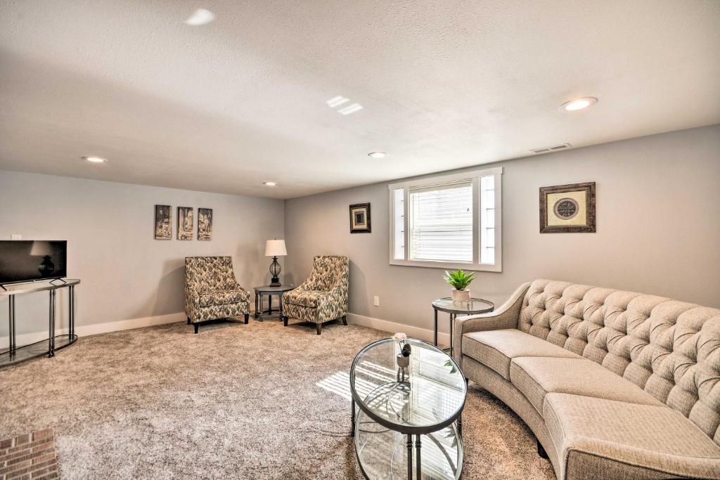 a living room with a couch and a tv at Renovated Apartment about 7 Mi to Dtwn Billings in Billings