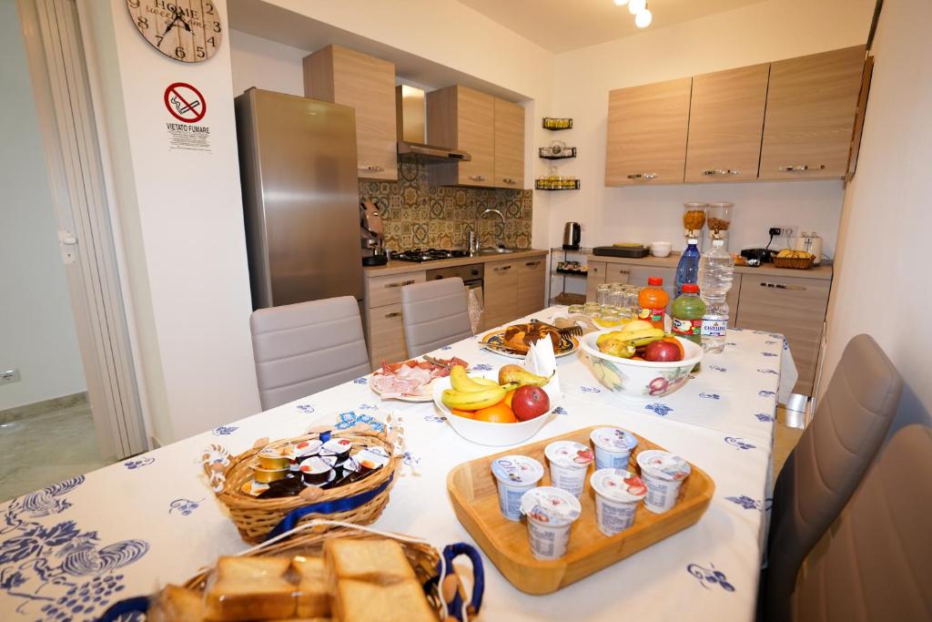 a kitchen with a table with bowls of food on it at Casa Astra in Anacapri