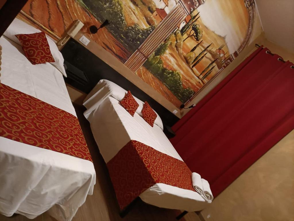 Postel nebo postele na pokoji v ubytování Albergo Corvetto Corso Lodi