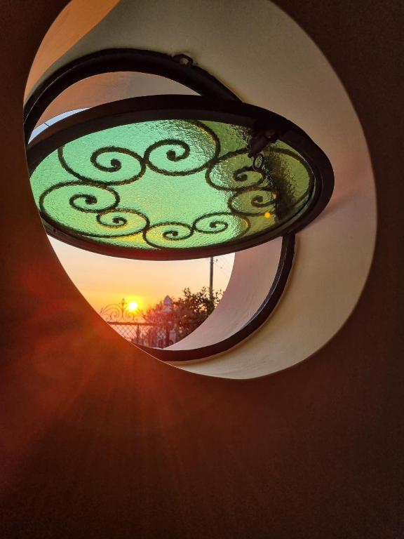 a reflection of a light in a circular mirror at Casa Astra in Anacapri