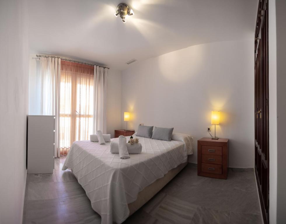 Кровать или кровати в номере Brasil Playa Ha Apartment