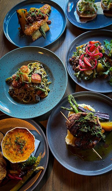 a group of plates of food on a table at Slaymaker & Nichols Gastro House & Inn in Charlottetown