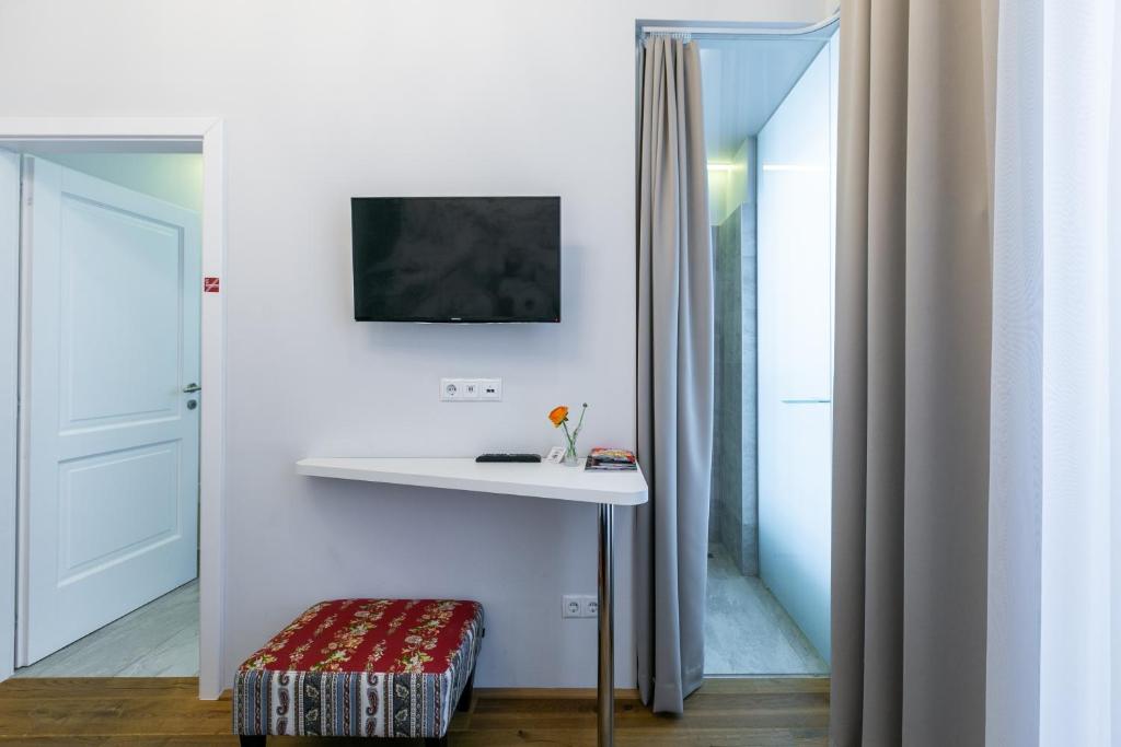 TV a/nebo společenská místnost v ubytování Room 55