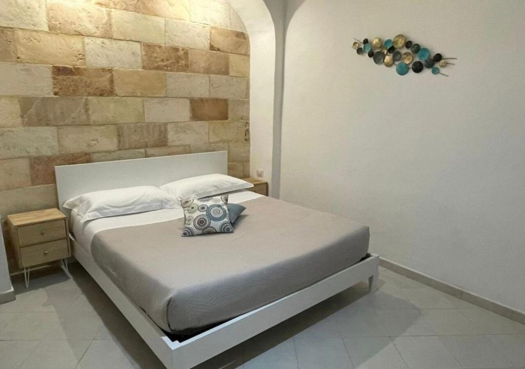 A bed or beds in a room at CASA VACANZE VIA CASALE