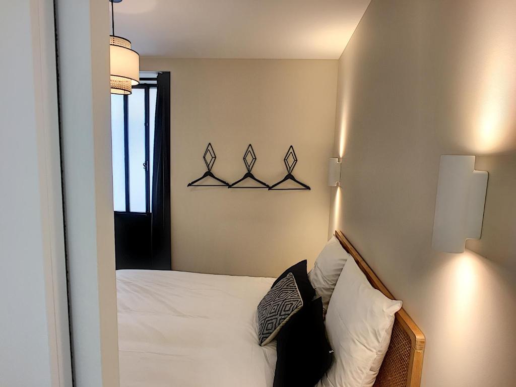 Postel nebo postele na pokoji v ubytování Maison Luxe 4 chambres - Patio - Climatisation - 10 minutes à pied du Pont d'Avignon