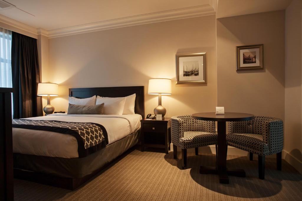 Postel nebo postele na pokoji v ubytování Hotel Rialto
