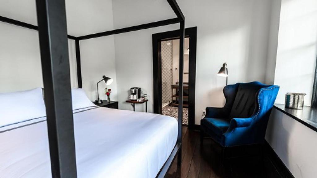 Postel nebo postele na pokoji v ubytování Hotel Giles