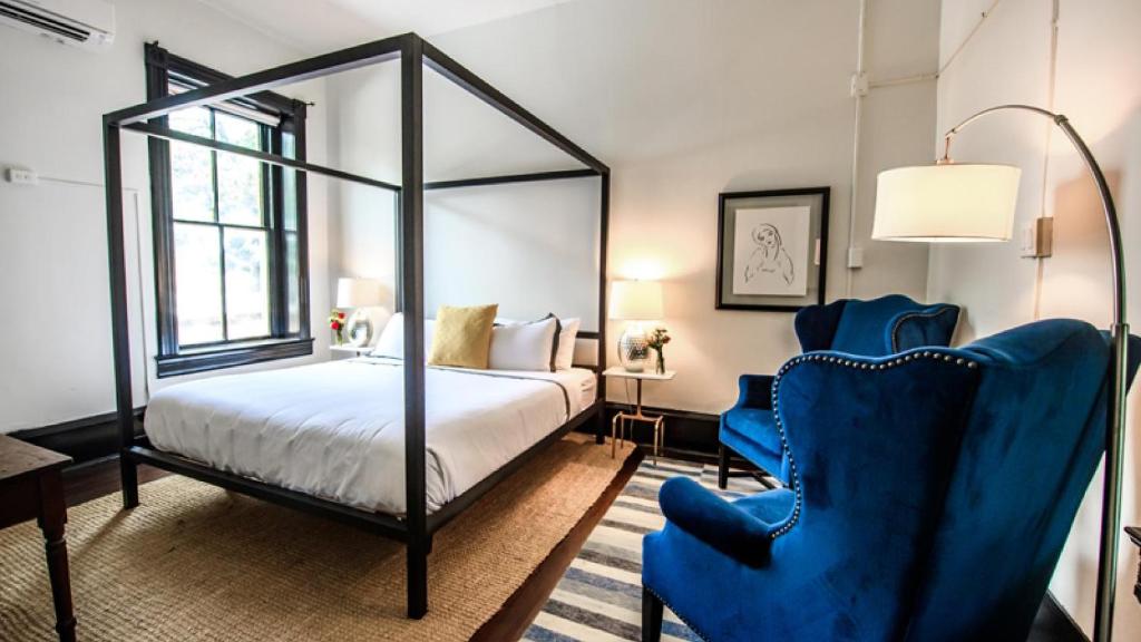 Postel nebo postele na pokoji v ubytování Hotel Giles